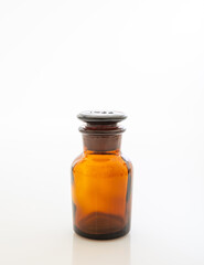 Brown drugs glass container isolated on white background.