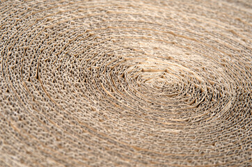 Paper cat scratcher background from recyclable cardboard