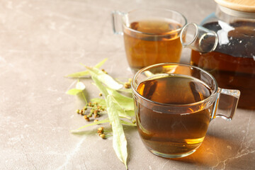 Composition with linden tea on gray background, close up. Natural tea