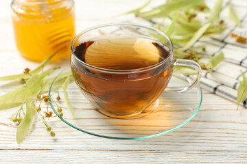 Composition with linden tea on wooden background, close up. Natural tea