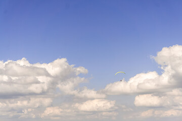 Fototapeta premium Flying on a paraglider in the sky above the clouds.