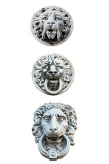 three plaster sculptures of lion heads to decorate the facade of the building isolated on a white background