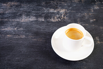 Cup of coffee espresso. Hot drink coffee on dark background