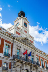 Fototapeta premium It's House of the Post Office on the Puerta del Sol, Madrid, Spain. Puerta del Sol is the centre (Km 0) of the radial network of Spanish roads.
