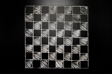 Hand drawn chess board on chalk board background.
