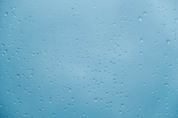 Water drops on a transparent polythene after a rain as a background image. Top view. Copy, empty space for text