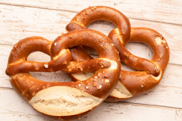 Freshly baked pretzels on a white background