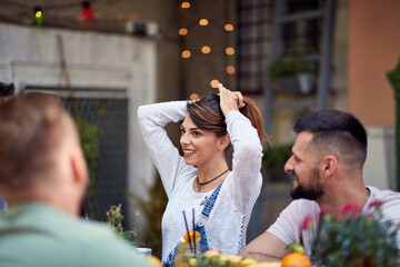 Young attractive girl in men company