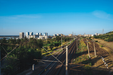 Railway with rails on the ground against the background of the city of Volgograd