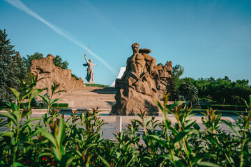 Beautiful panorama of Mamayev Kurgan in the city of Volgograd, photographed from under the blooming...
