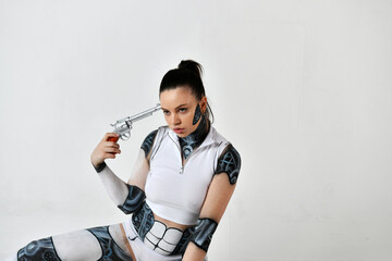 beautiful brunette girl in a robot suit with a serb pistol