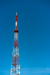 High signal transmitter on a blue sky background, minimalism