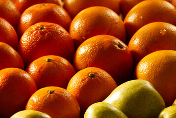 Closeup of fresh oranges and pears