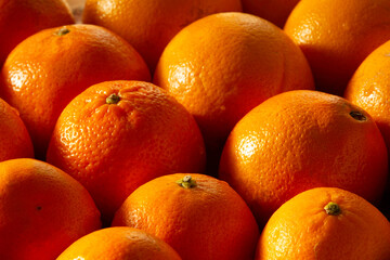 Closeup of fresh oranges stack together