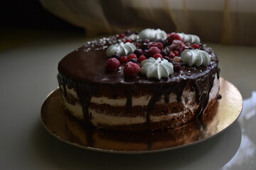 chocolate cake with fruit and meringue