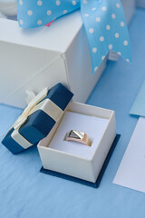 Golden male ring with diamonds in box, copy space