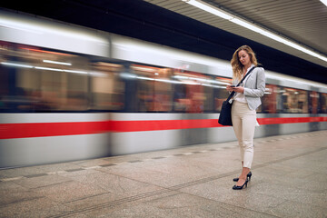 Businesswoman casually waiting for a subway transport