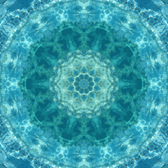 abstract background of pattern of kaleidoscope. white blue turquoise background fractal mandala....