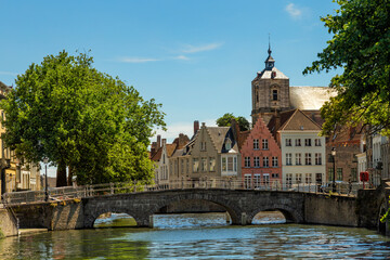Bruges city view with canals and an old bridge