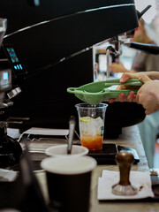 Barista making ice tea in espresso bar,close up