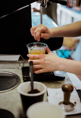 Barista making ice tea in espresso bar,close up