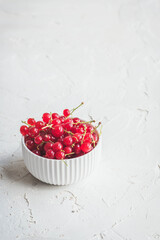 Red currants in a white bowl