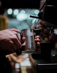 Barista making cappuccino, bartender preparing coffee drink
