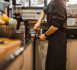  Close up of creative barista with temper make coffee
