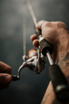 Europe, Germany, Berlin, Mueggelheim, Grosse Krampe lake, fishing on a trunk.
