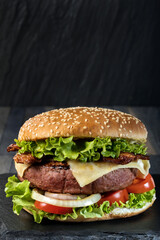 A classic big hamburger with crispy bacon