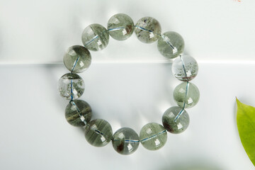 gem bracelet in front of white background 
