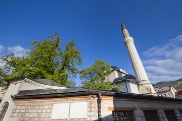 Roof and minaret of the Gazi Husrev Begova mosque in Sarajevo. The mosque is one of the main landmarks of the islamic muslim ottoman part of the capital city of Bosnia and Herzegovina.