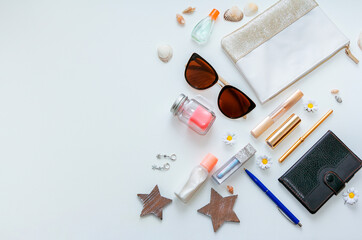 Outfit of young woman or modern teenager girl on white background - cosmetic and lifestyle accessories. Flat lay objects.