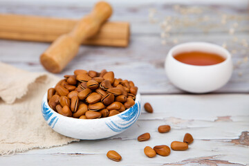 Pine nuts on wood background