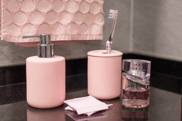 Pink Amenities and accesories for modern bathroom. 