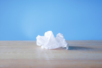 simple toilet paper on blue background. roll of toilet paper on white background