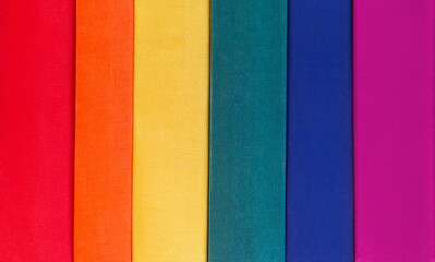 LGBT colours background. Book covers symbolize respect for minority rights.
