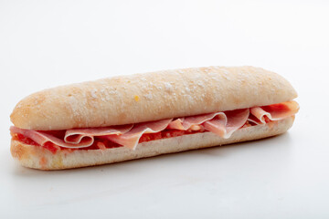 bocadillo  de jamón y tomate sobre fondo blanco. Ham and tomato sandwich on a white background.