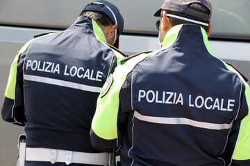 Municipal police checks the self-certification to passengers arriving in the city with an...