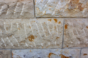 Old stone wall with cracks background