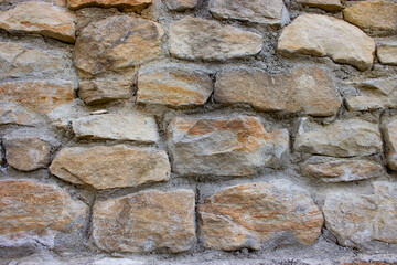 Old stone wall with cracks background