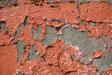 Red aged and distressed close-up paint flakes