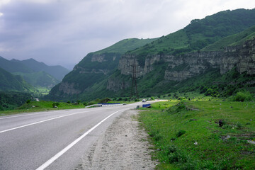 Auto road with cars in the mountains