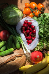 Flat lay composition organic raw vegetarian food in sun lights.