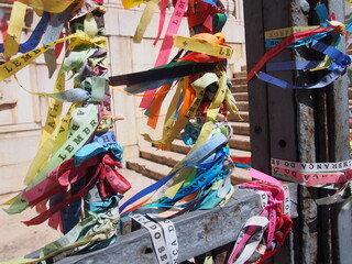 Colorful Bonfim Ribbon wrapped around the gate railing, Pelourinho, Salvador, Brazil