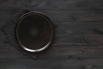 Empty plate on black