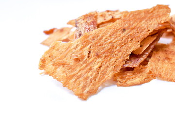 baked dry crispy salty and sweet squid slice arranging on white background