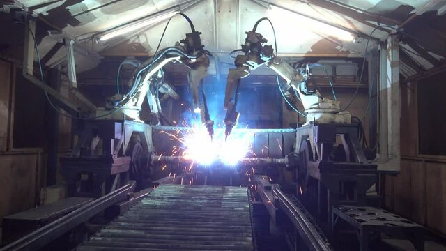 Automation welding mechanical procedure.,Industrial Robot arm active in factory
