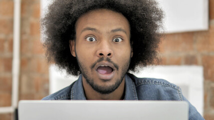 Close up of Shocked African Man at Work