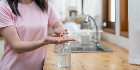 Hands of woman washing with clean water in the kitchen at home during coronavirus crisis or covid-19 outbreak